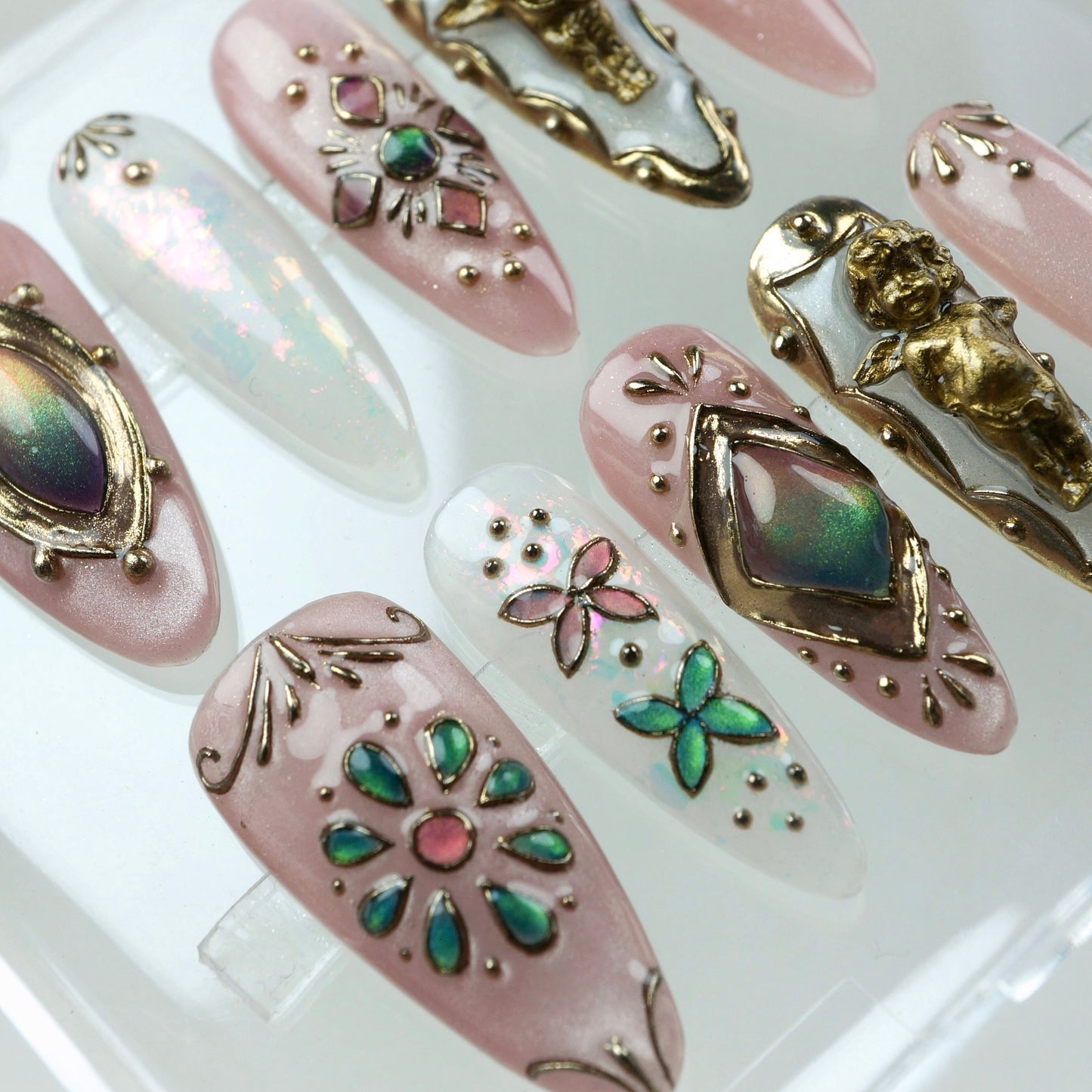 A dreamy mix of celestial shimmer and antique charm, these press-on nails showcase baroque gold details and playful butterflies.
