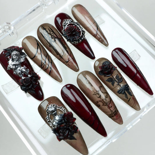 Dark romance meets elegance in this gothic nail set from Donailsart, featuring 3D roses, cherubs, and baroque-style linework.