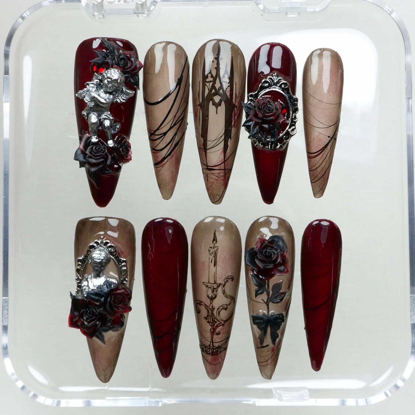 Dark romance meets elegance in this gothic nail set from Donailsart, featuring 3D roses, cherubs, and baroque-style linework.