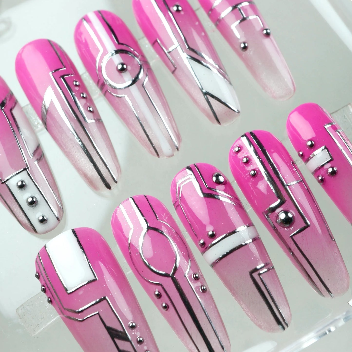Donailsart press-on nails with digital grid lines, glossy pinks, and techwear-inspired motifs for a modern twist