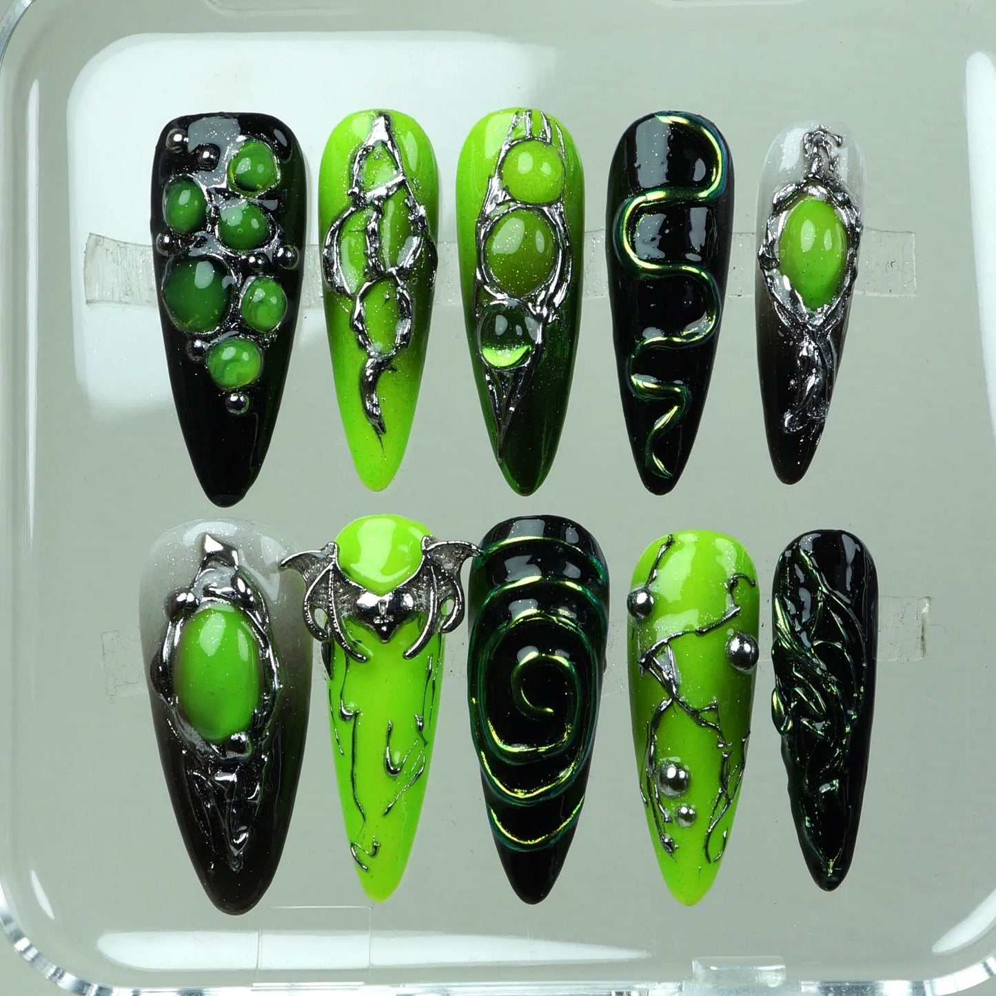 Donailsart press-on nails featuring slime green gradients, galactic swirls, and extraterrestrial chrome patterns