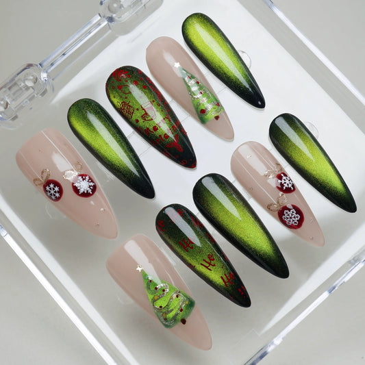 Holiday nail set featuring green gradient shine, festive Ho Ho Ho prints, and cute ornament and tree designs Donailsart
