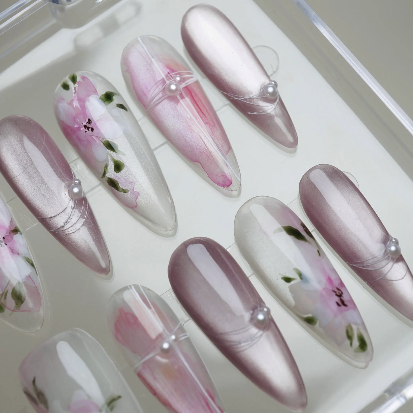 Petal Drift press-on nail set product view with soft translucent pearl, blush pink, and hand-painted botanical nail art by Donailsart