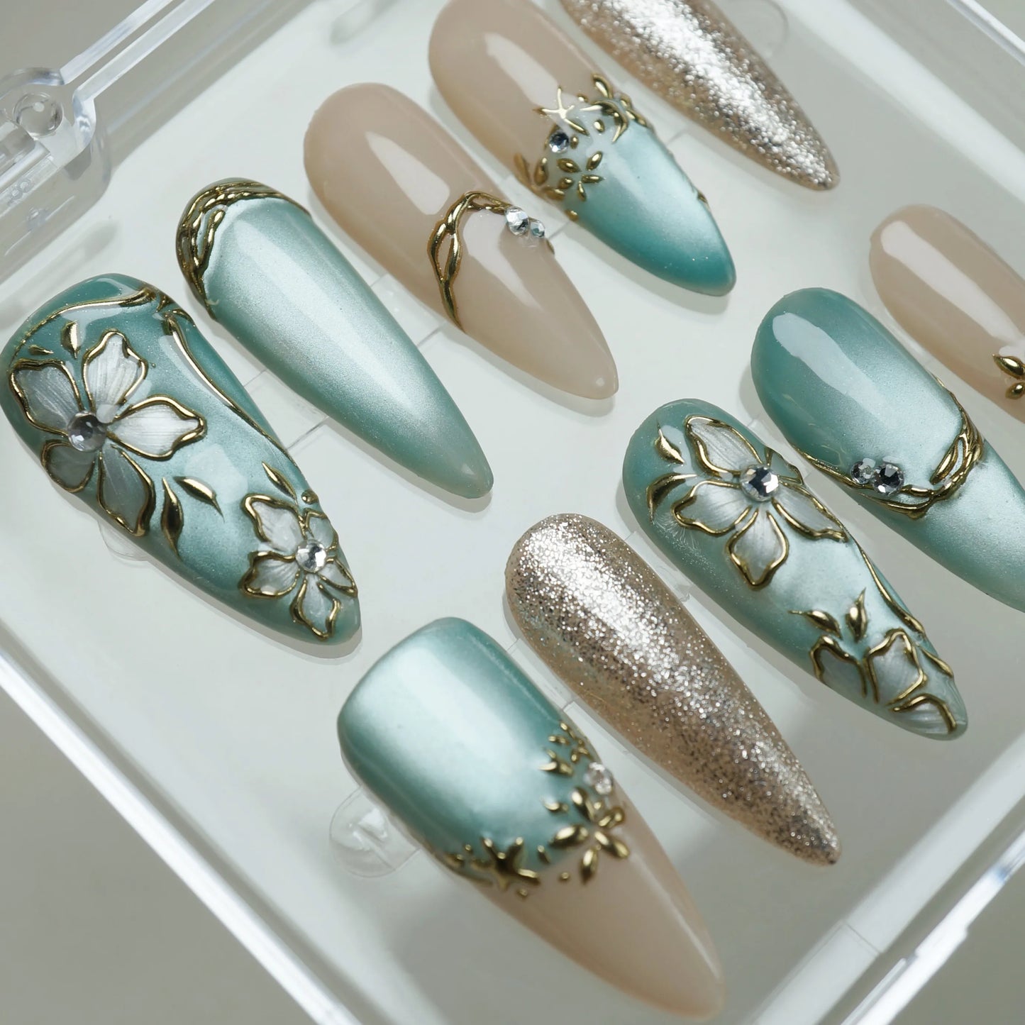 Tidal Heirloom press-on nail set product view with timeless seafoam blue, champagne nude, and antique gold nail art by Donailsart
