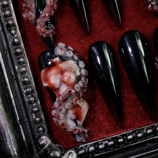Haunted Doll press-on nails, angled close-up of 3D porcelain doll face