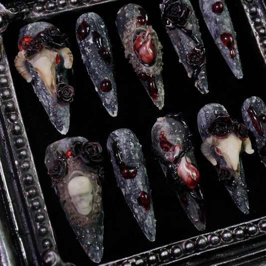 Baphomet press-on nails, angled close-up of 3D skulls and red roses