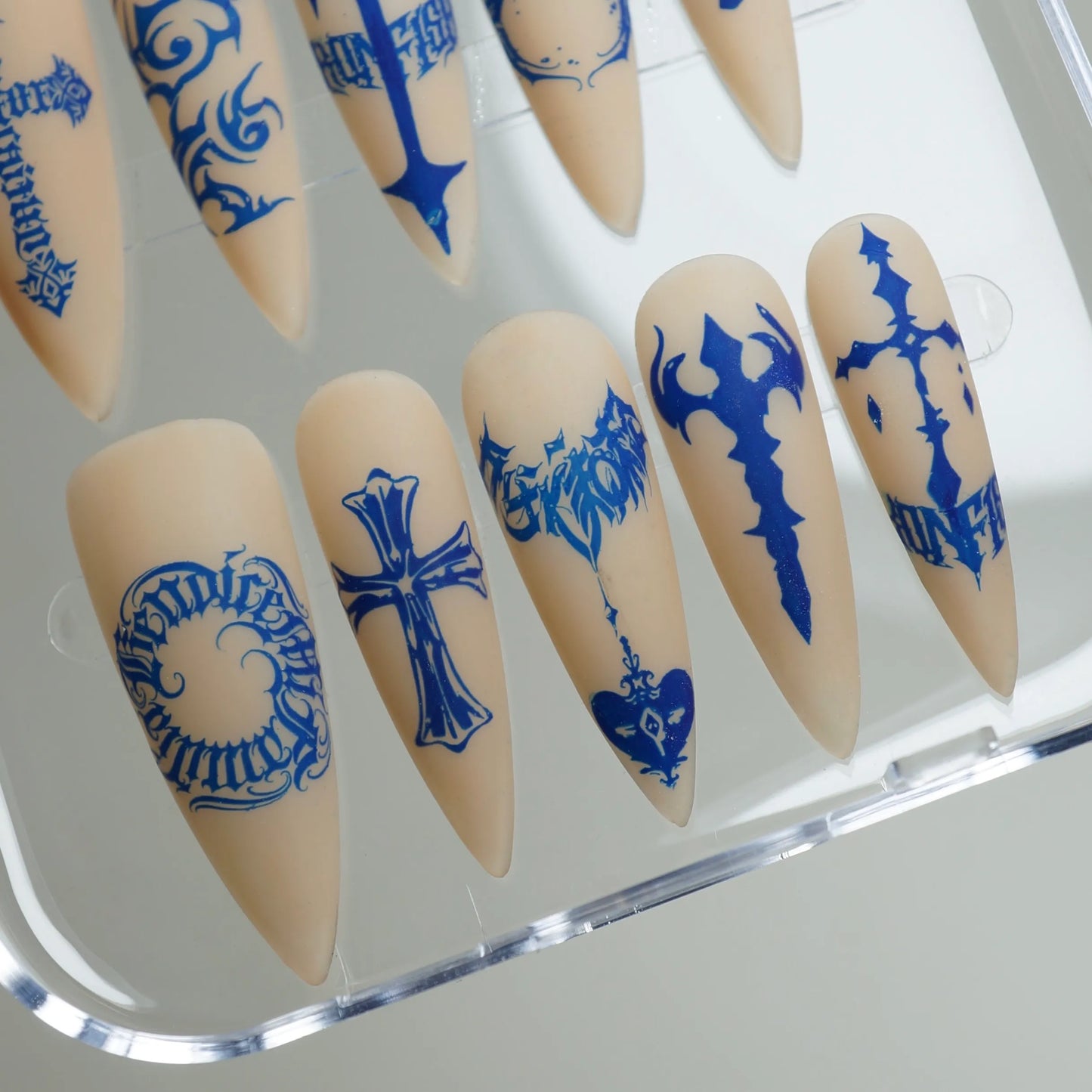 Blue Heresy press-on nail set product view with bold cobalt sacred symbol and graphic nail art by Donailsart