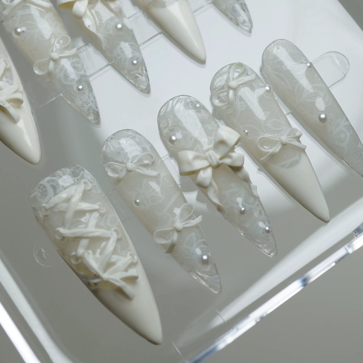 Ivory Keepsake press-on nail set product view with refined elegant lace, bow, and pearl nail art by Donailsart