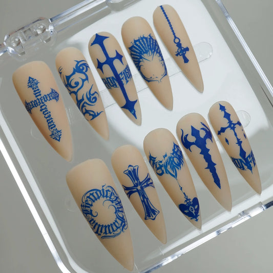 Blue Heresy press-on nails on display showing the full graphic symbol and cross nail art collection – Donailsart