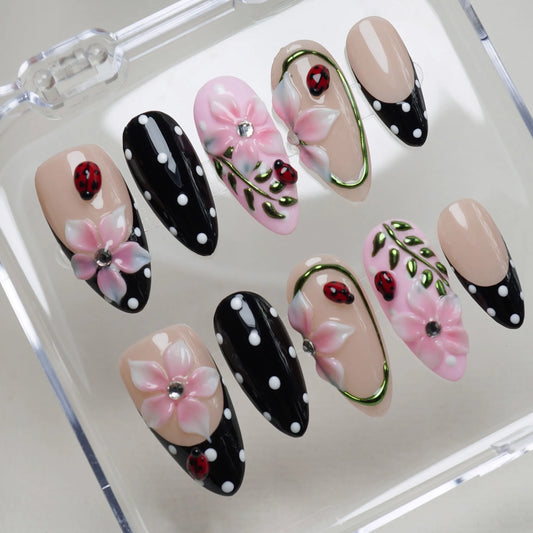 Ladybug Parlor press-on nails on display showing the full ladybug garden nail art collection with black tips – Donailsart