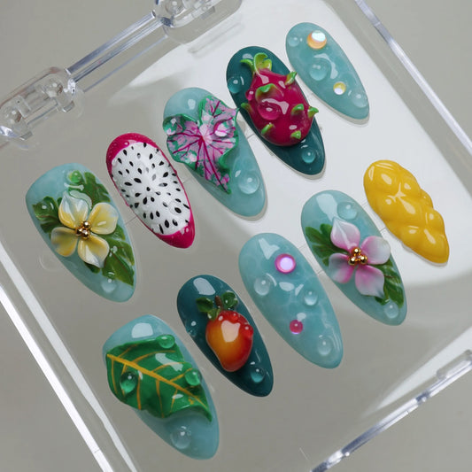 Tropic Trinkets press-on nails on a clear display stand showing the full tropical summer nail set – Donailsart