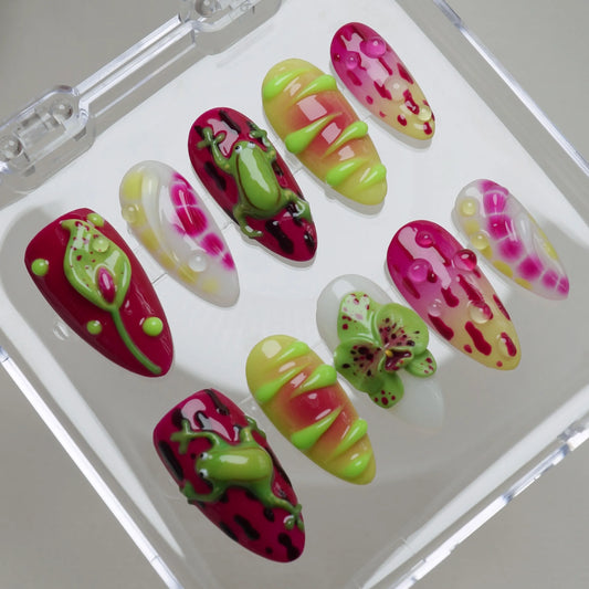 Frog Pop press-on nails arranged on a clear display tray, showing the full set of colorful summer nail art designs – Donailsart
