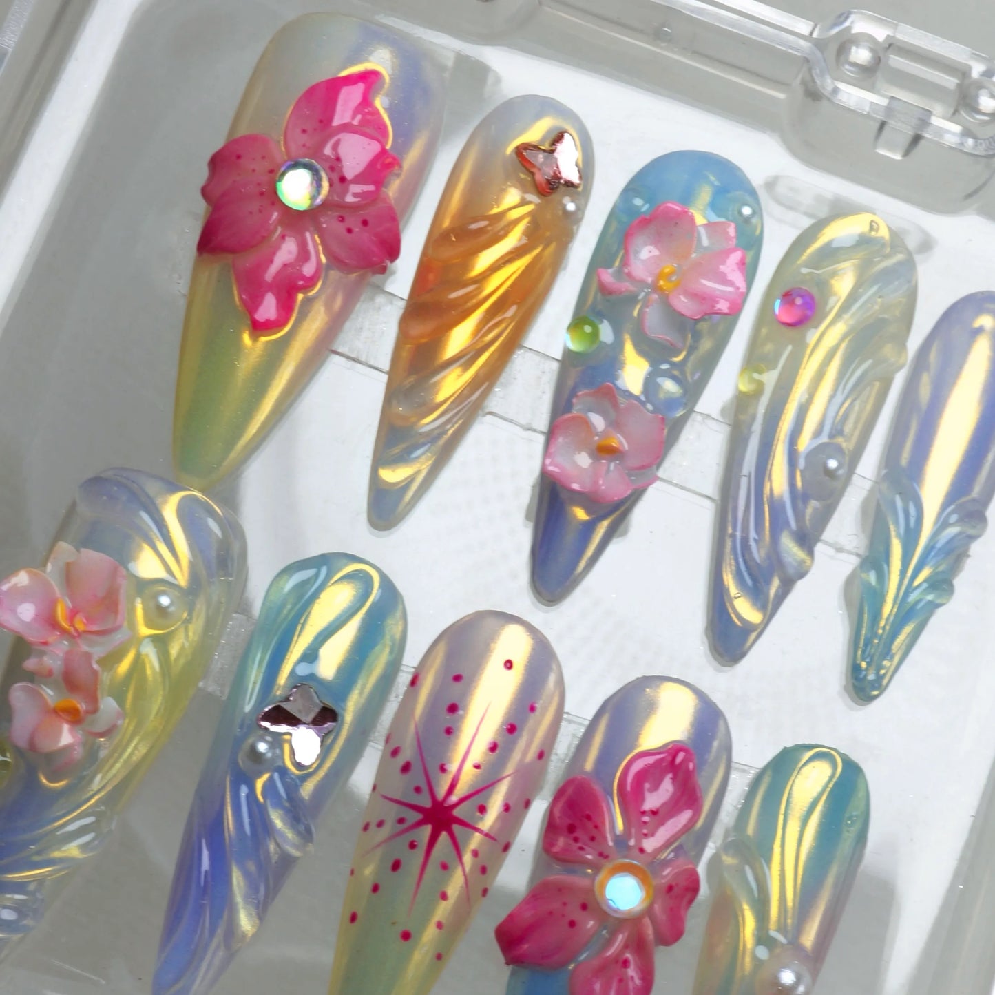 Press-on summer flower nails with transparent shimmer, hand-crafted petals, and delicate dewdrop effects