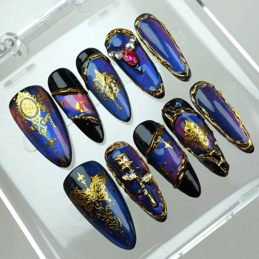 Royal-themed press-on nails featuring cosmic gradients, ornate gold details, and 3D gemstone settings