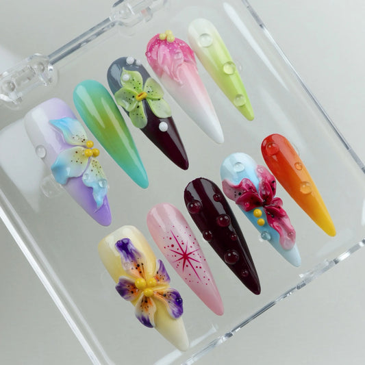 Donailsart press-on nails featuring sculpted floral designs, ombré bases, and whimsical water droplet textures
