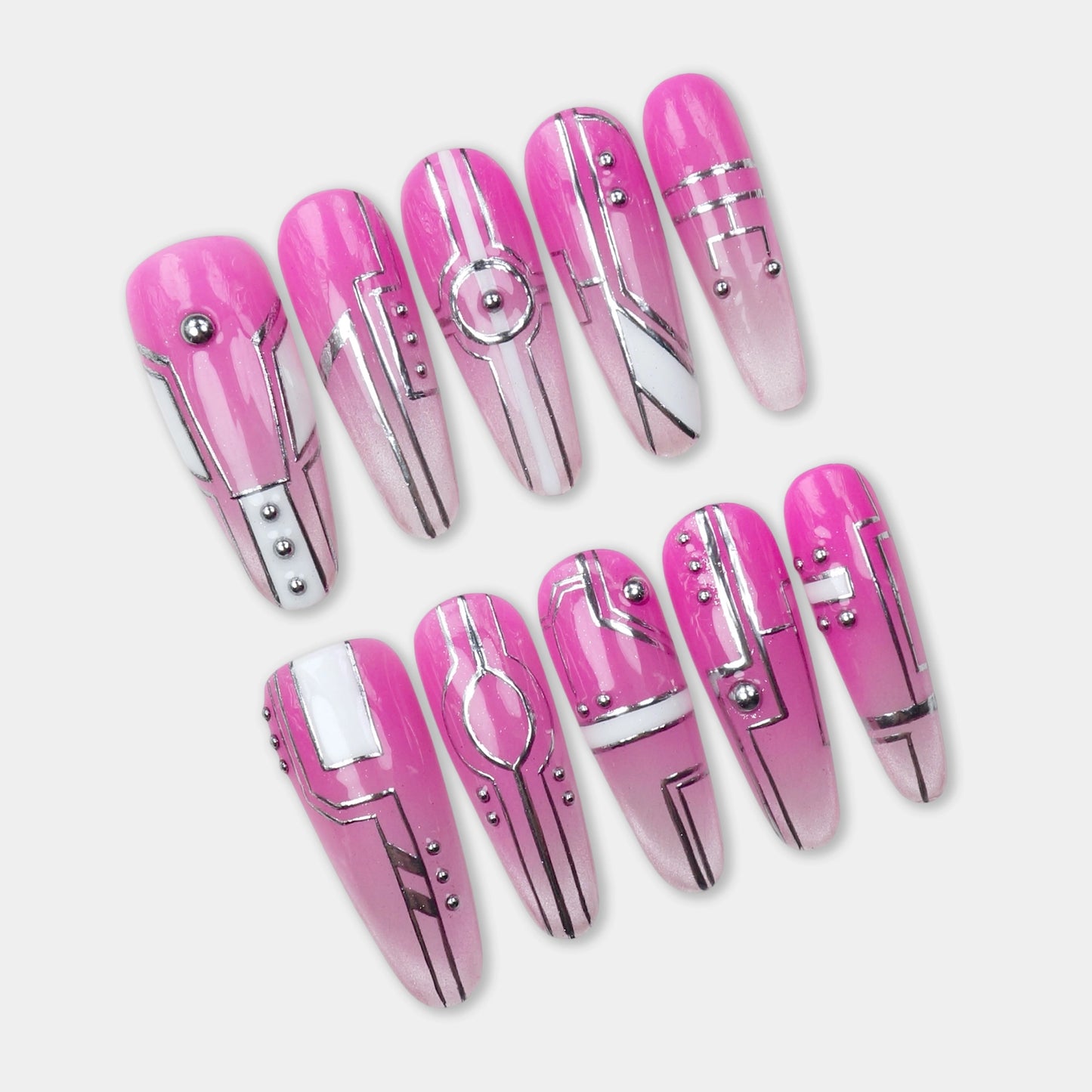 Press-on nails with hot pink and chrome base featuring geometric lines, metallic studs, and tech-inspired patterns by Donailsart