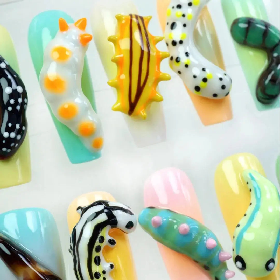 Adorable Grub press-on nail set product view with fun vibrant summer nature-inspired nail art by Donailsart