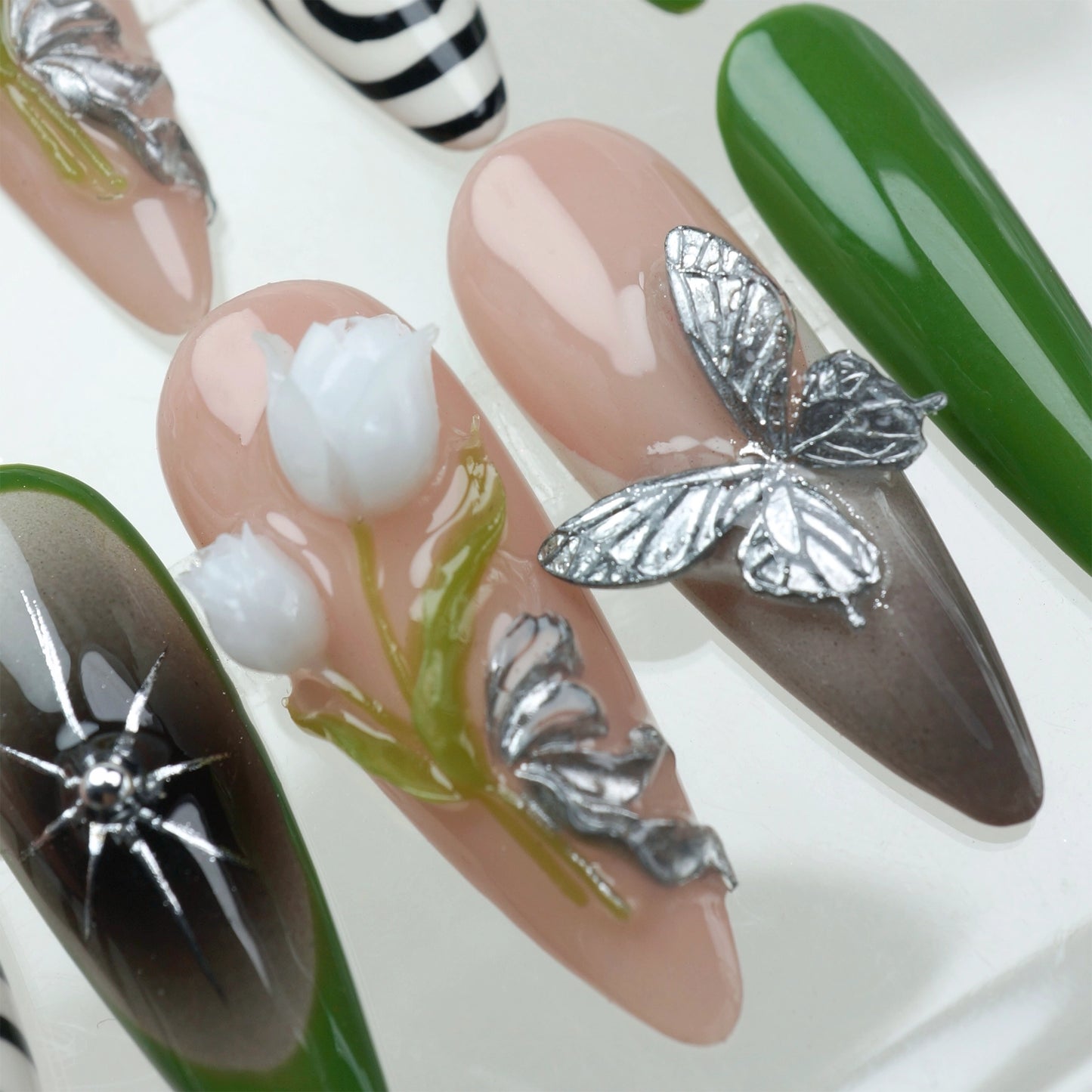 Elegant flower nails with sculpted tulip details, metallic butterflies, and forest green tips, perfect for nature-inspired press-on looks