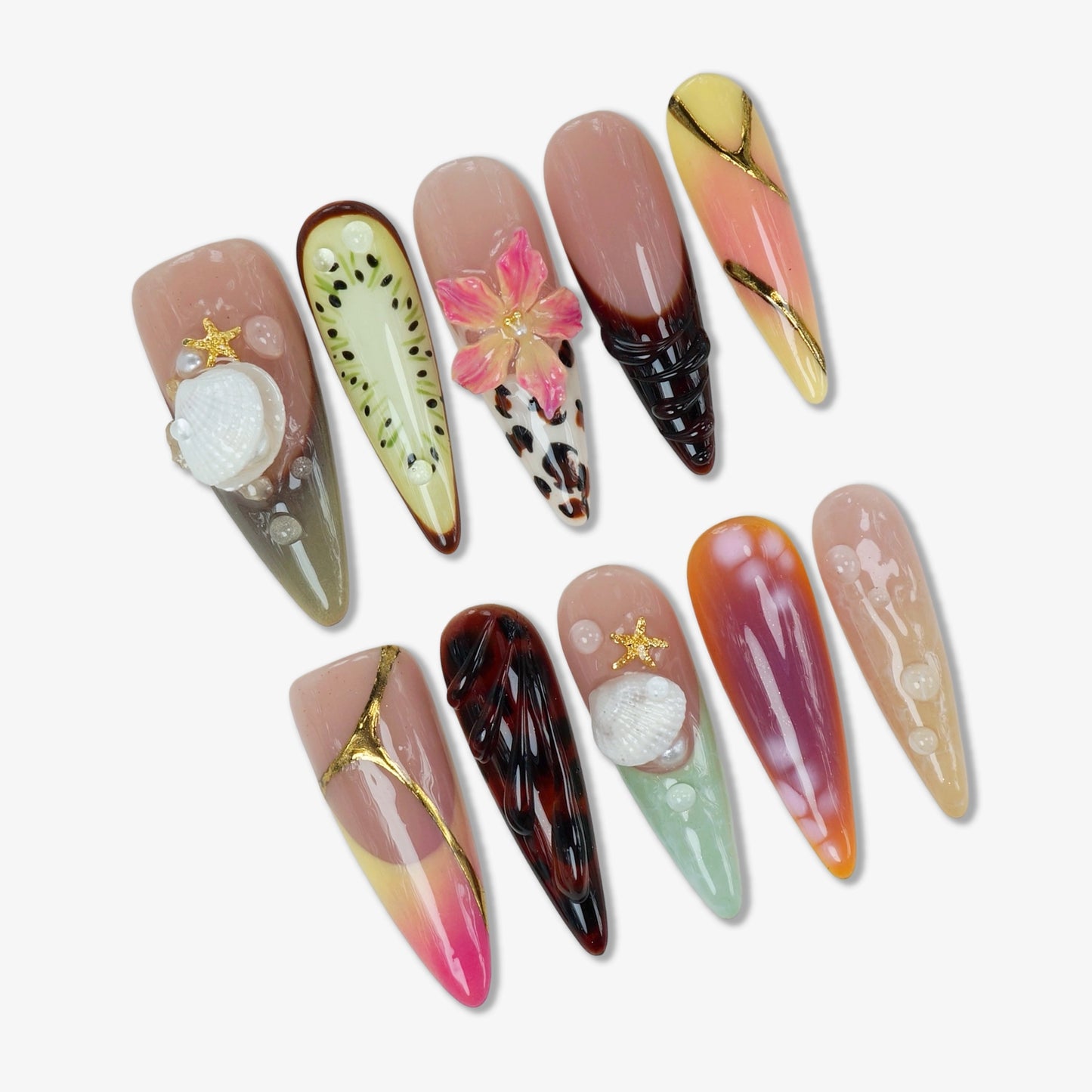 Colorful summer nails with tropical and beach-inspired 3D designs, including seashells, fruit slices, and floral accents.