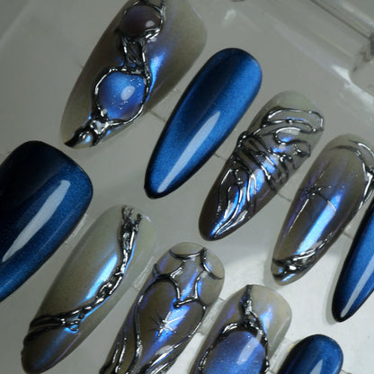 Donailsart press-on nails in midnight blue and reflective silver, with high-shine finishes and dimensional chrome designs