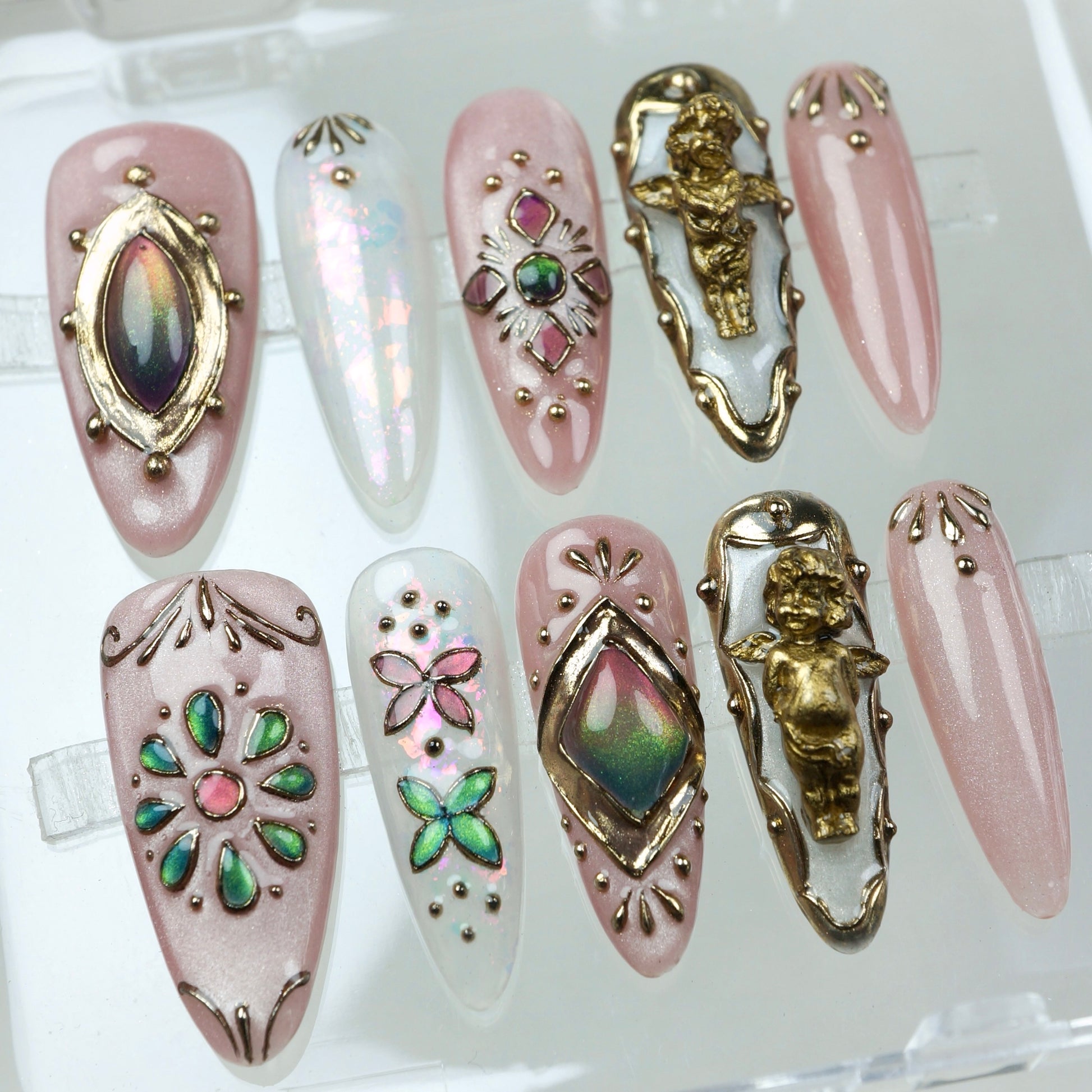 A dreamy mix of celestial shimmer and antique charm, these press-on nails showcase baroque gold details and playful butterflies.