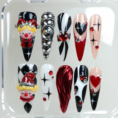 Whimsical clown nails from Donailsart with circus vibes, heart motifs, and 3D face details in carnival colors.