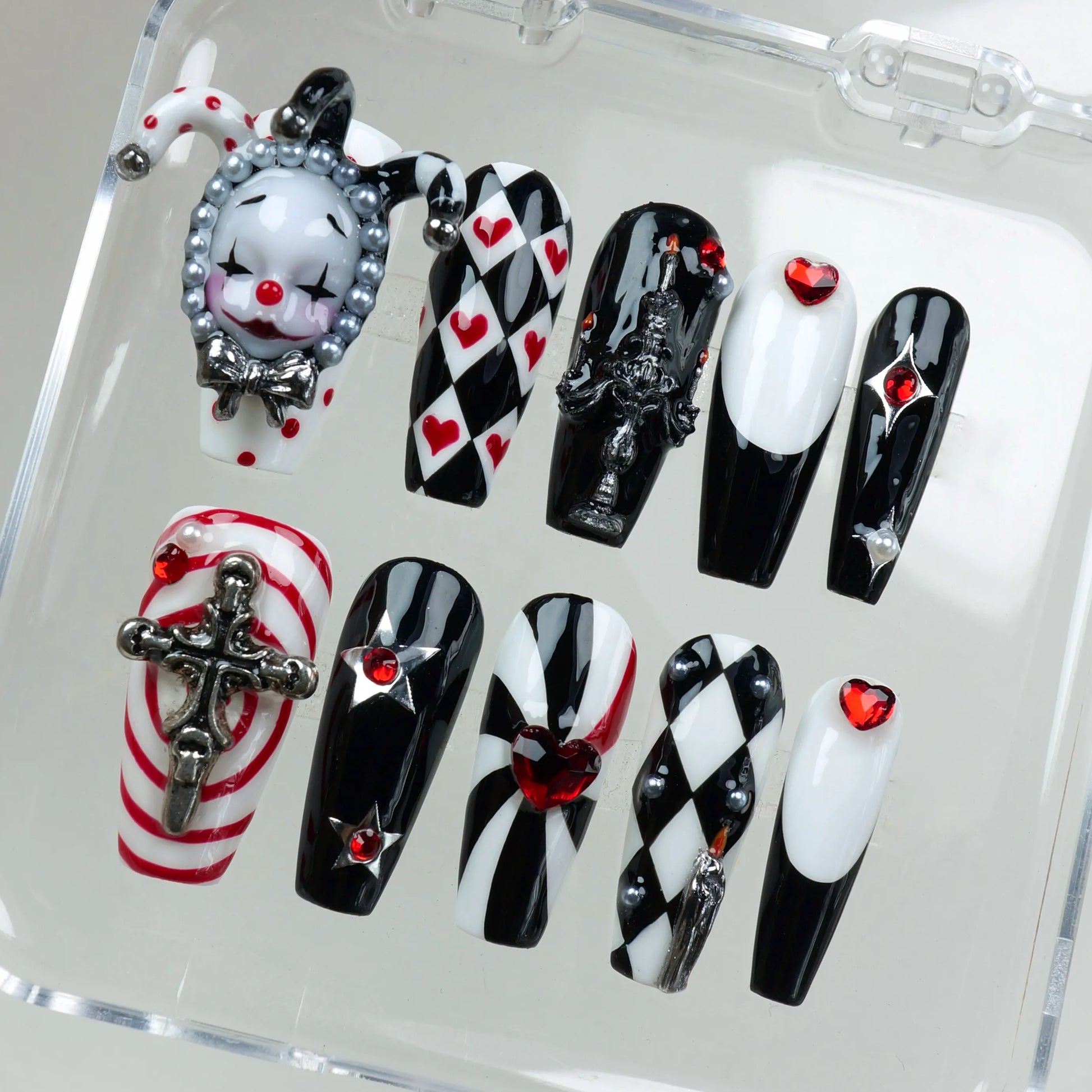 High-drama press-on nails with checkerboard patterns, pearls, and sculpted metal accents, designed by Donailsart.