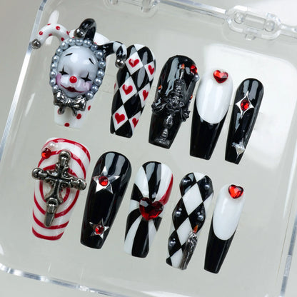 High-drama press-on nails with checkerboard patterns, pearls, and sculpted metal accents, designed by Donailsart.
