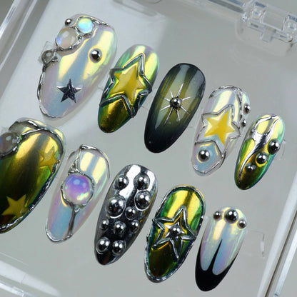 Galaxy-inspired press-on nails with chrome finish, 3D stars, celestial jewels, and holographic details.