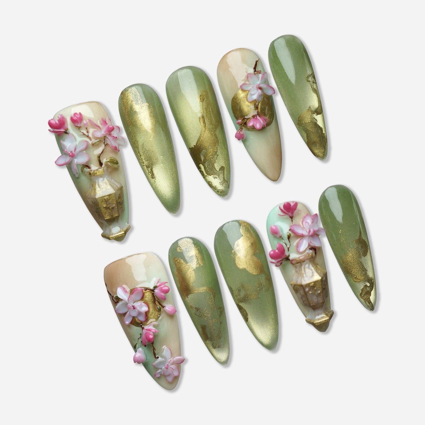 Garden Reverie press-on nail set by Donailsart – soft jade green nails with flowing gold accents, sculpted sakura blossom flowers, and ornamental vase detail