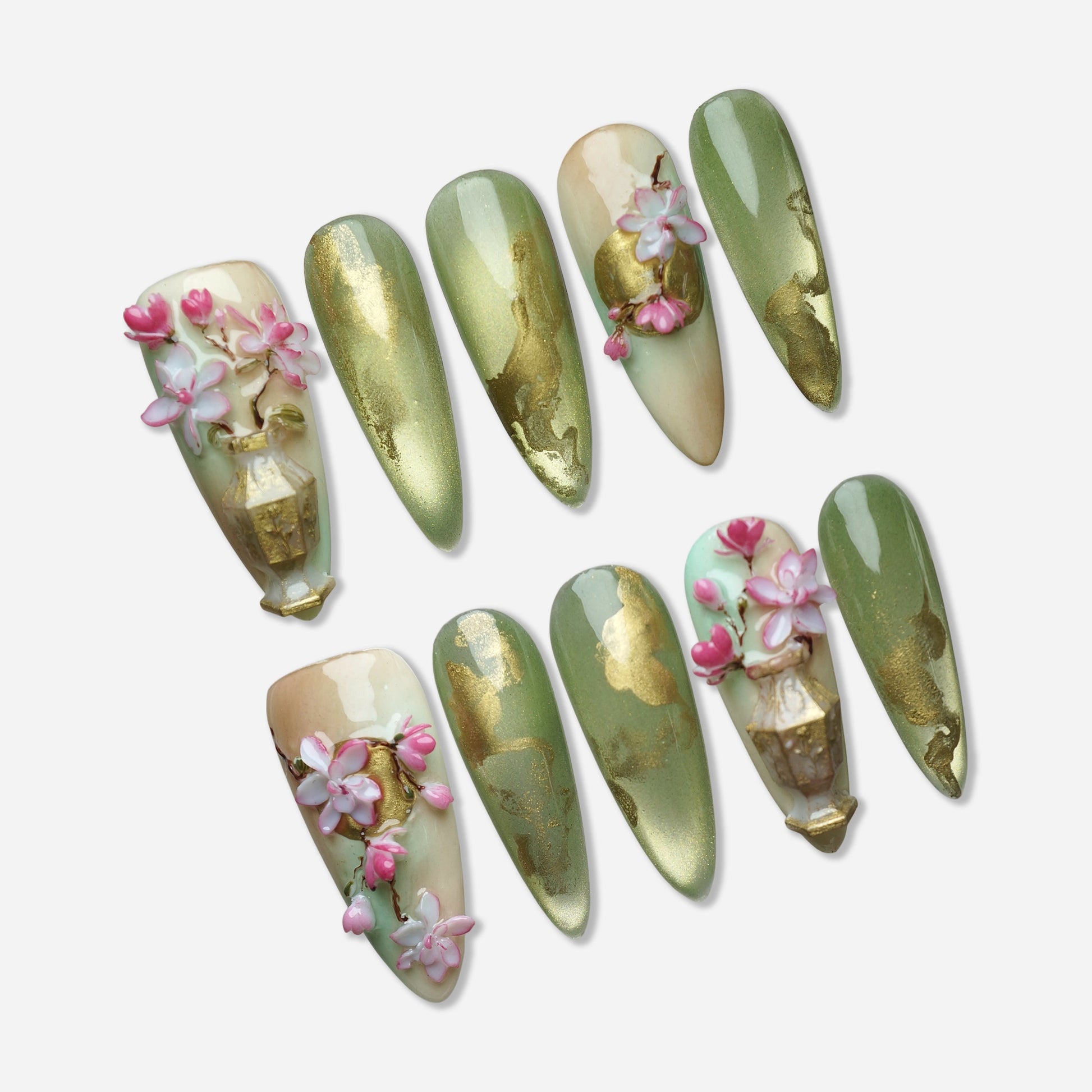 Garden Reverie press-on nail set by Donailsart – soft jade green nails with flowing gold accents, sculpted sakura blossom flowers, and ornamental vase detail
