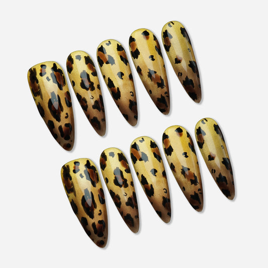 Gilded Wild press-on nail set by Donailsart – radiant metallic gold chrome nails with warm caramel tones and rich tortoiseshell leopard detail overlay