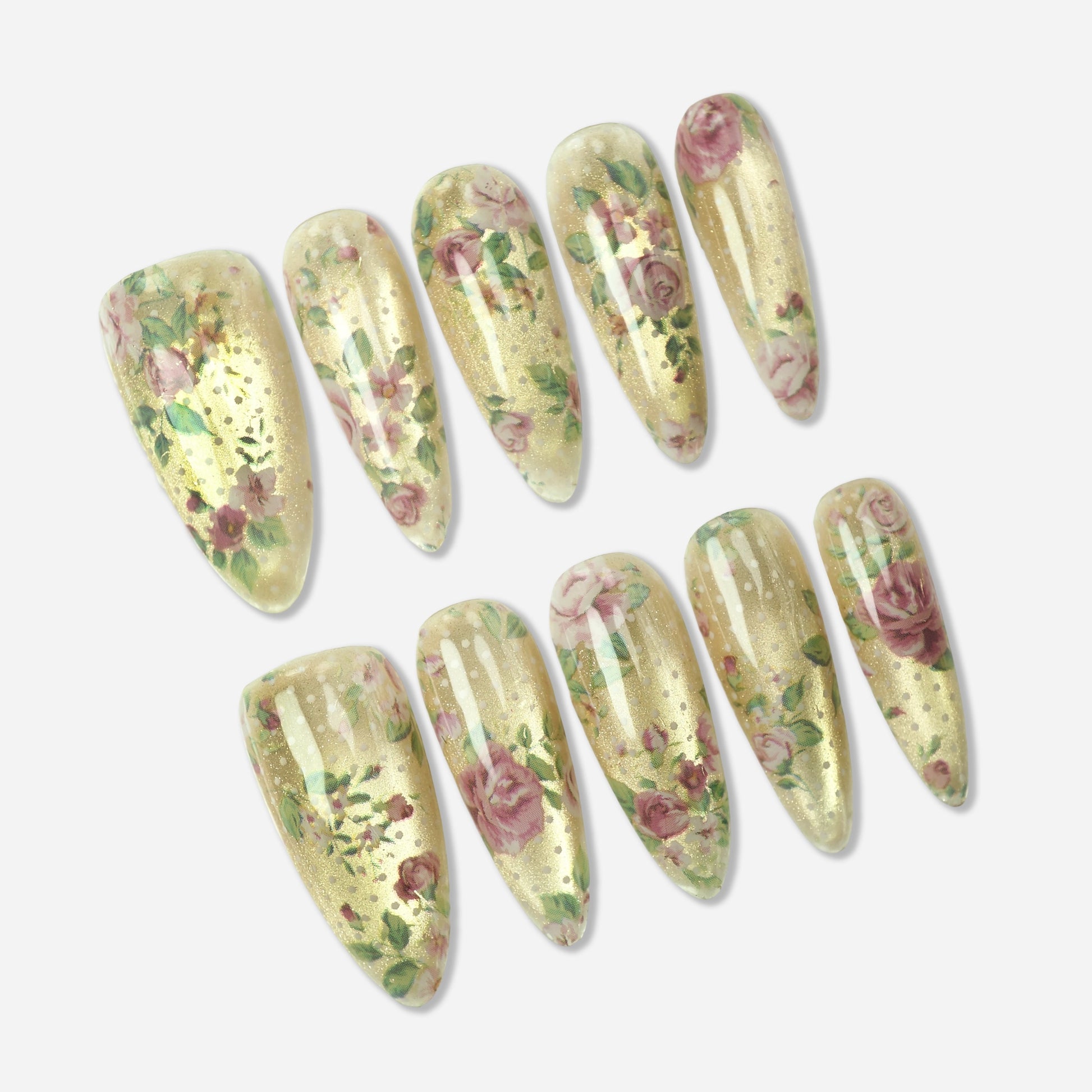 Heirloom Petals press-on nail set by Donailsart – luminous golden champagne base nails with vintage rose prints, tiny blossom details, and leafy stem accents