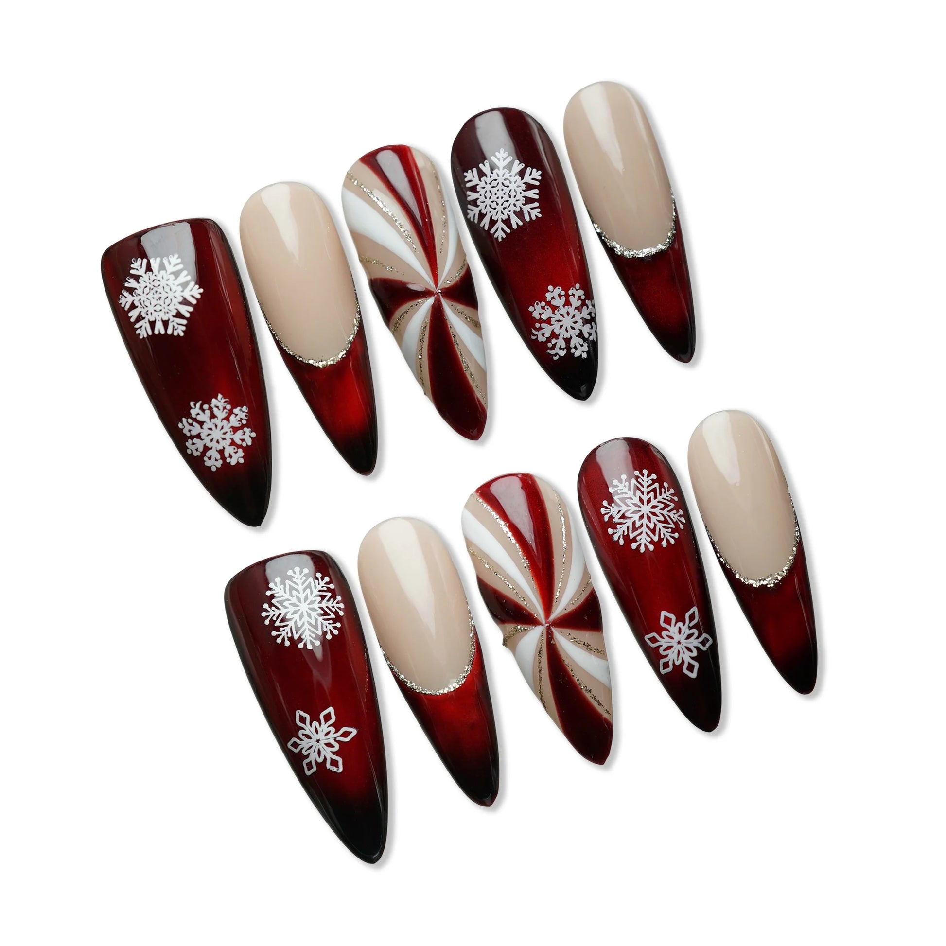 Red and nude press-on nails with snowflake designs and candy swirl Christmas accents from Donailsart