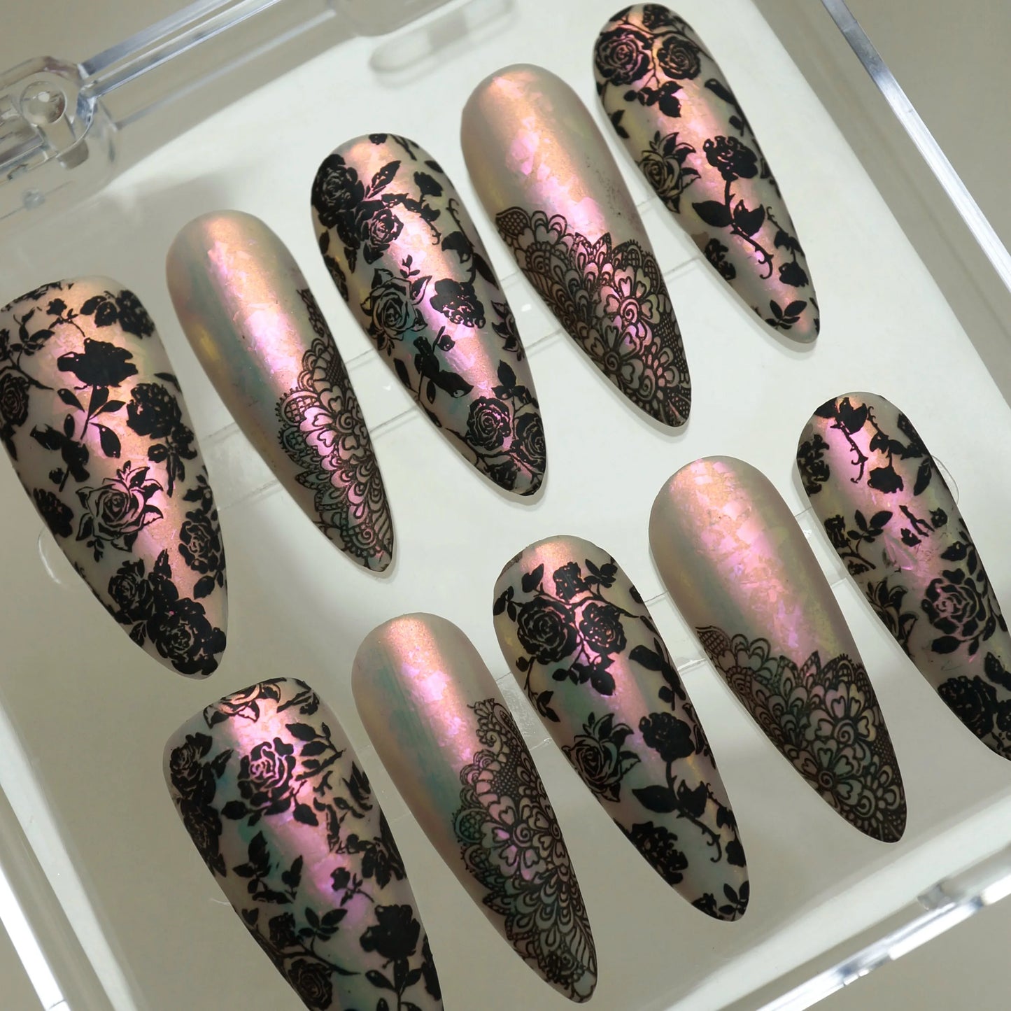Opaline Veil press-on nails side angle showing ethereal iridescent pearl base and black lace nail art – Donailsart