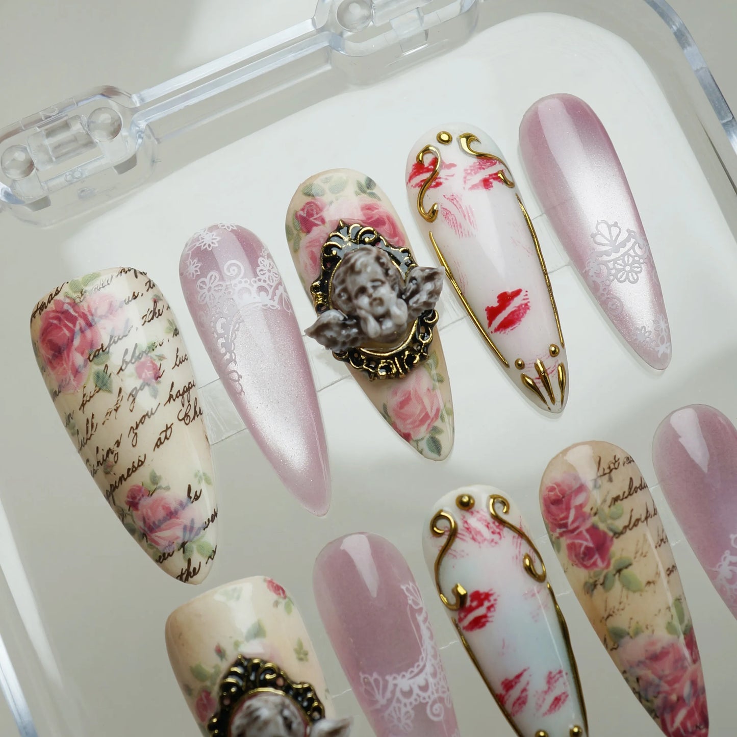 Cherub Relique press-on nail set product view with heirloom blush, cherub, and vintage lace gold nail art by Donailsart