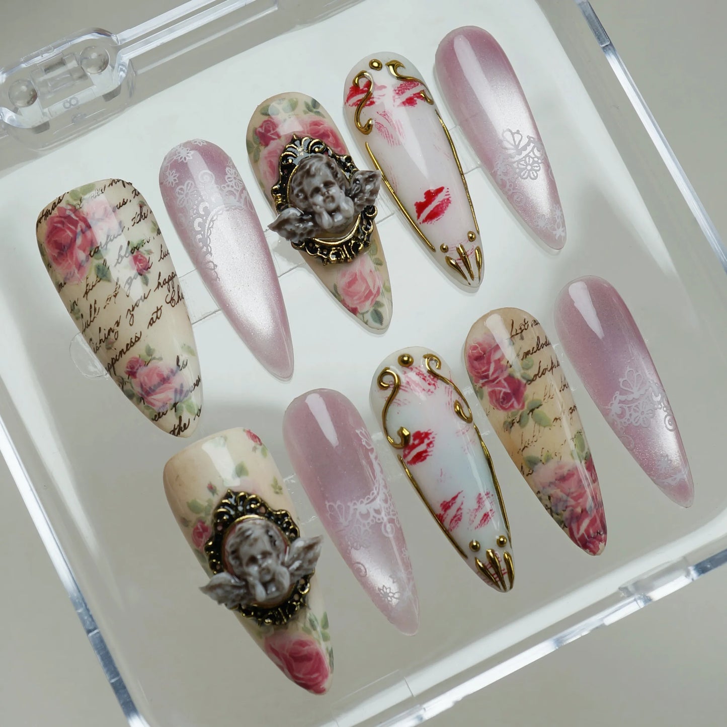 Cherub Relique nail art detail view featuring handwritten script texture and antique rose prints on blush nails – Donailsart
