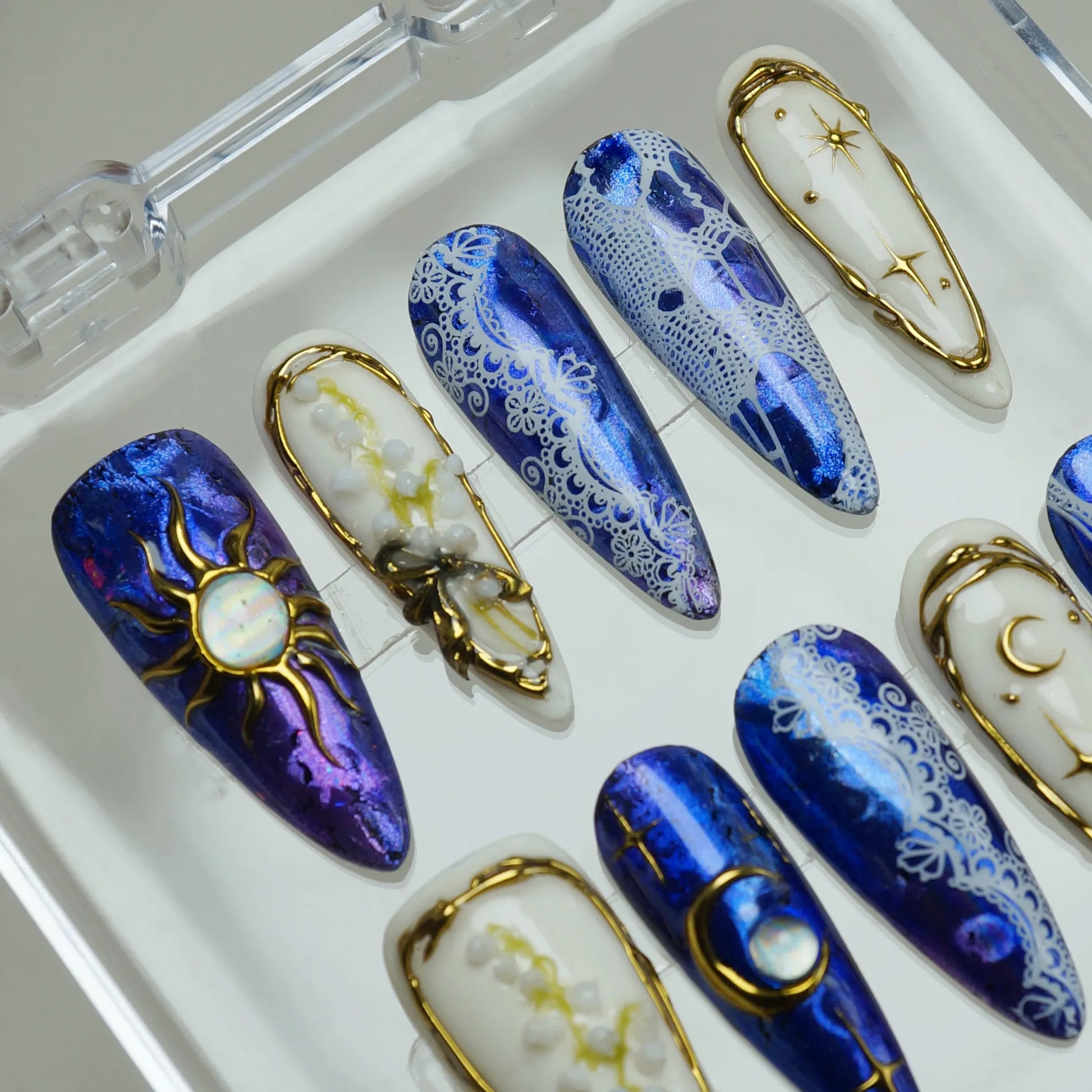 Celestine Sovereign press-on nail set product view with powerful midnight cobalt, gold celestial, and opal nail art by Donailsart