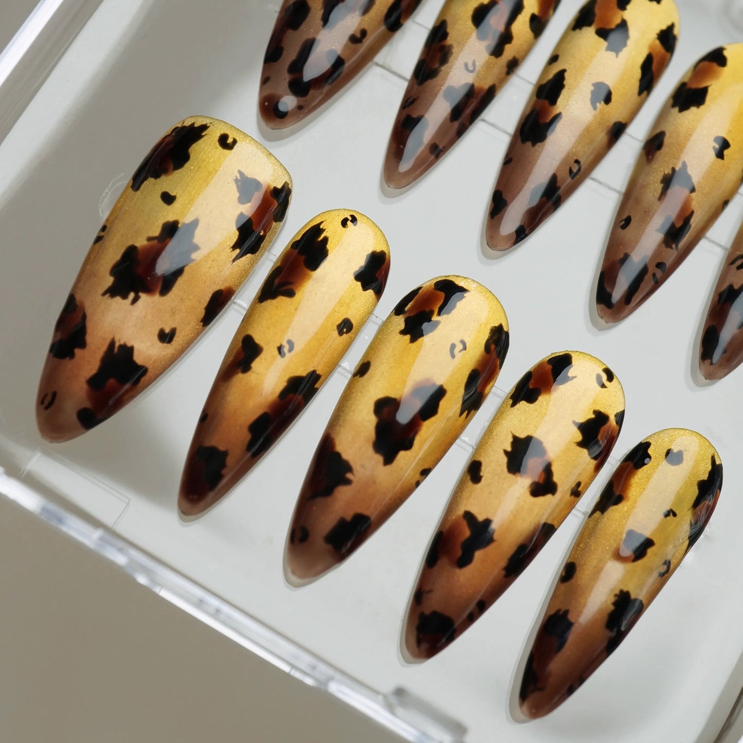 Gilded Wild close-up detail showing rich tortoiseshell leopard pattern over a molten metallic gold chrome nail – Donailsart