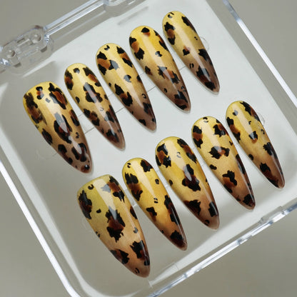 Gilded Wild press-on nails on display showing the full metallic gold and tortoiseshell leopard nail art collection – Donailsart