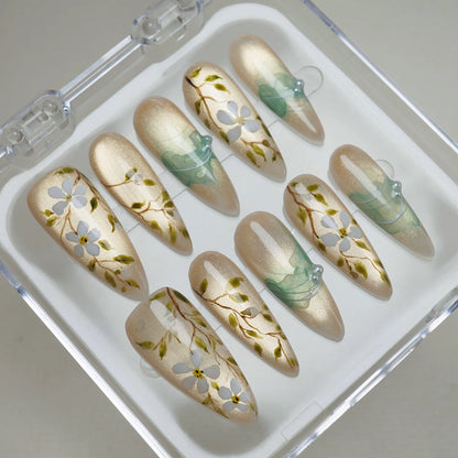 Orchard Veil press-on nails on display showing the full champagne gold floral vine nail art collection – Donailsart