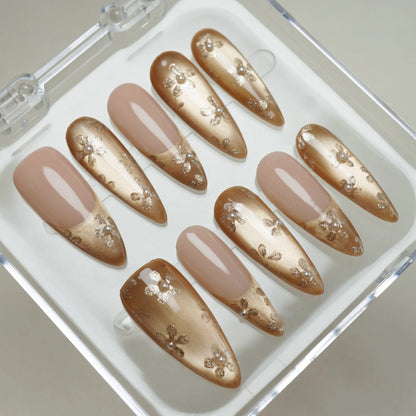 Gilded Whisper press-on nails on display showing the full champagne gold and pearl floral nail art collection – Donailsart