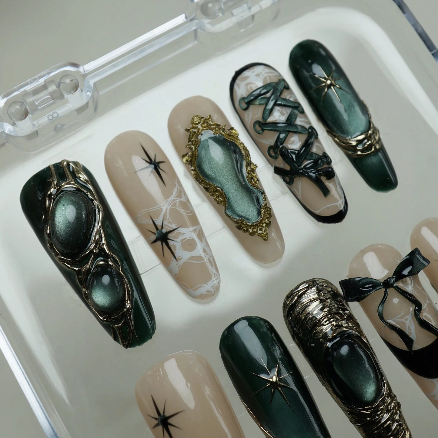 Velour Noire press-on nail set product view with mysterious emerald cat-eye, gold, and lace nail art by Donailsart