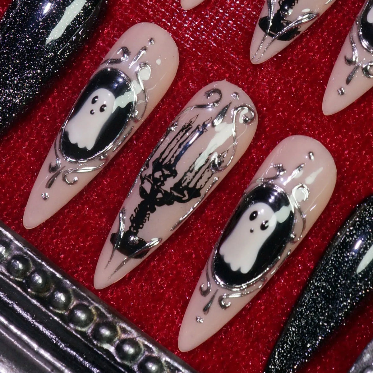 Midnight Cameo press-on nails, detail shot of silver cameo ghost art