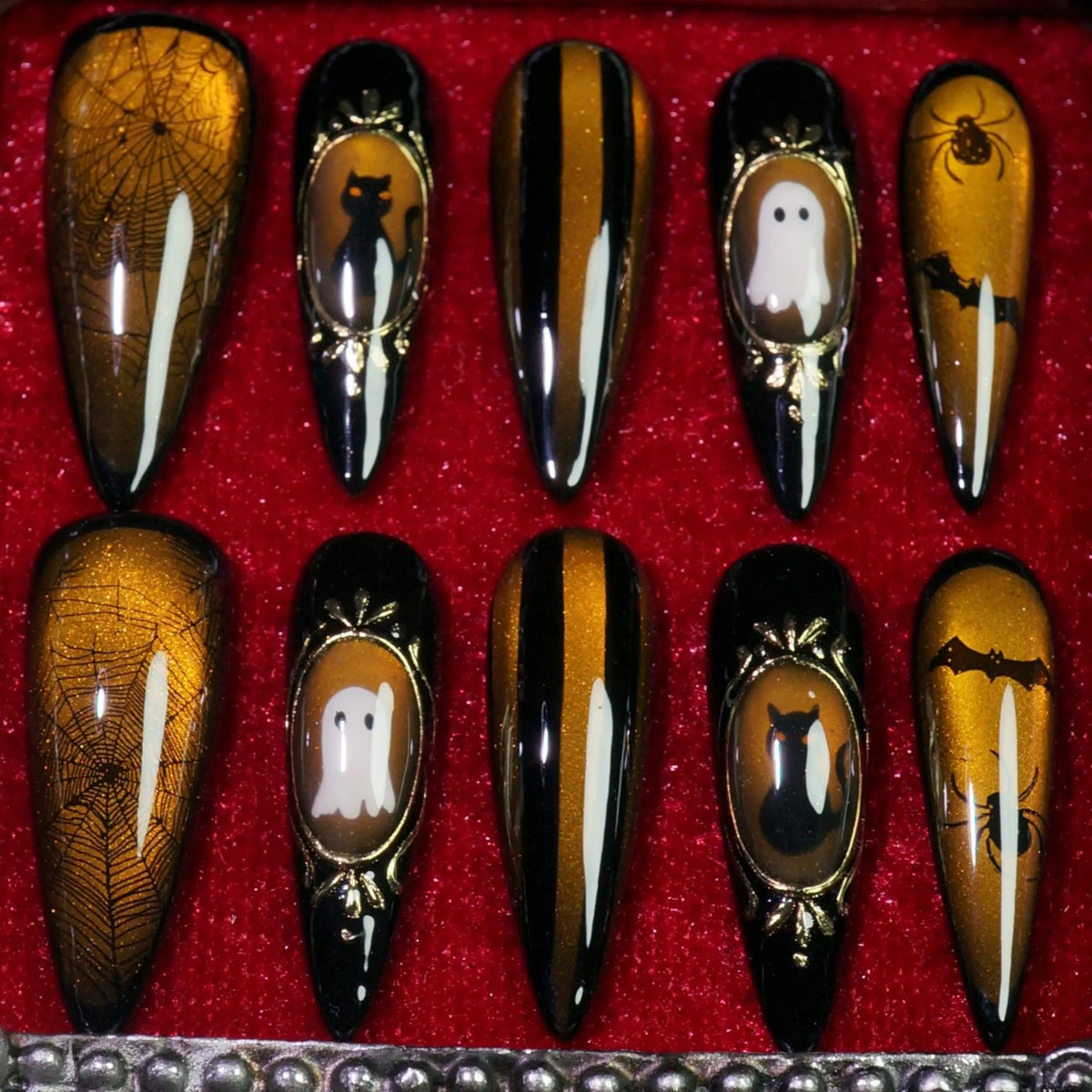 Amber Haunt press-on nails, side view of gold cameo Halloween frames