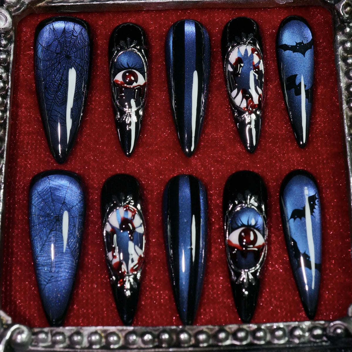 Azure Nightmare press-on nails, detail shot of framed eyeball cameos