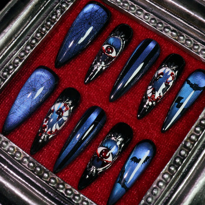 Azure Nightmare press-on nails, angled close-up of framed eyeball cameos