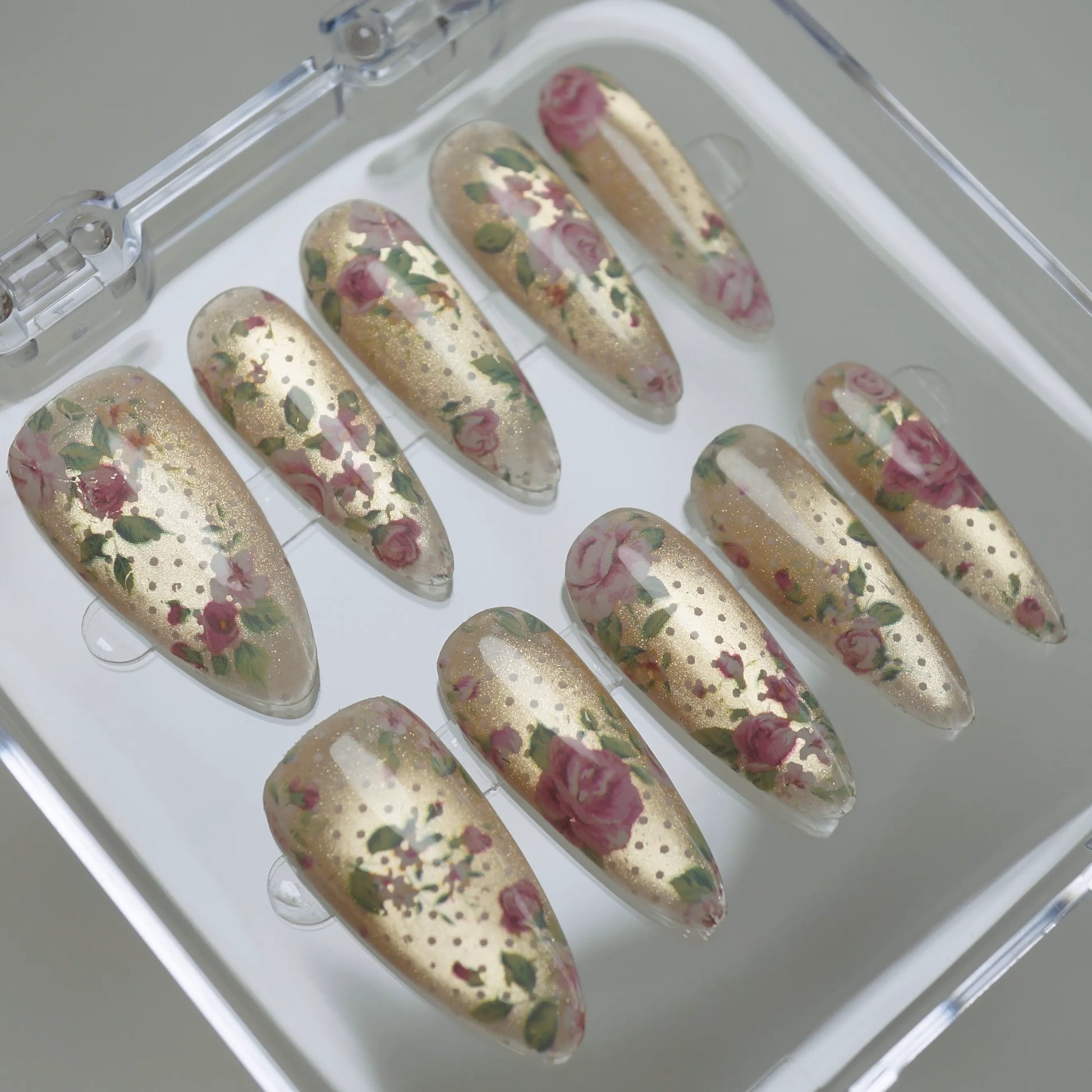 Heirloom Petals press-on nails on display showing the full vintage rose and champagne gold nail art collection – Donailsart