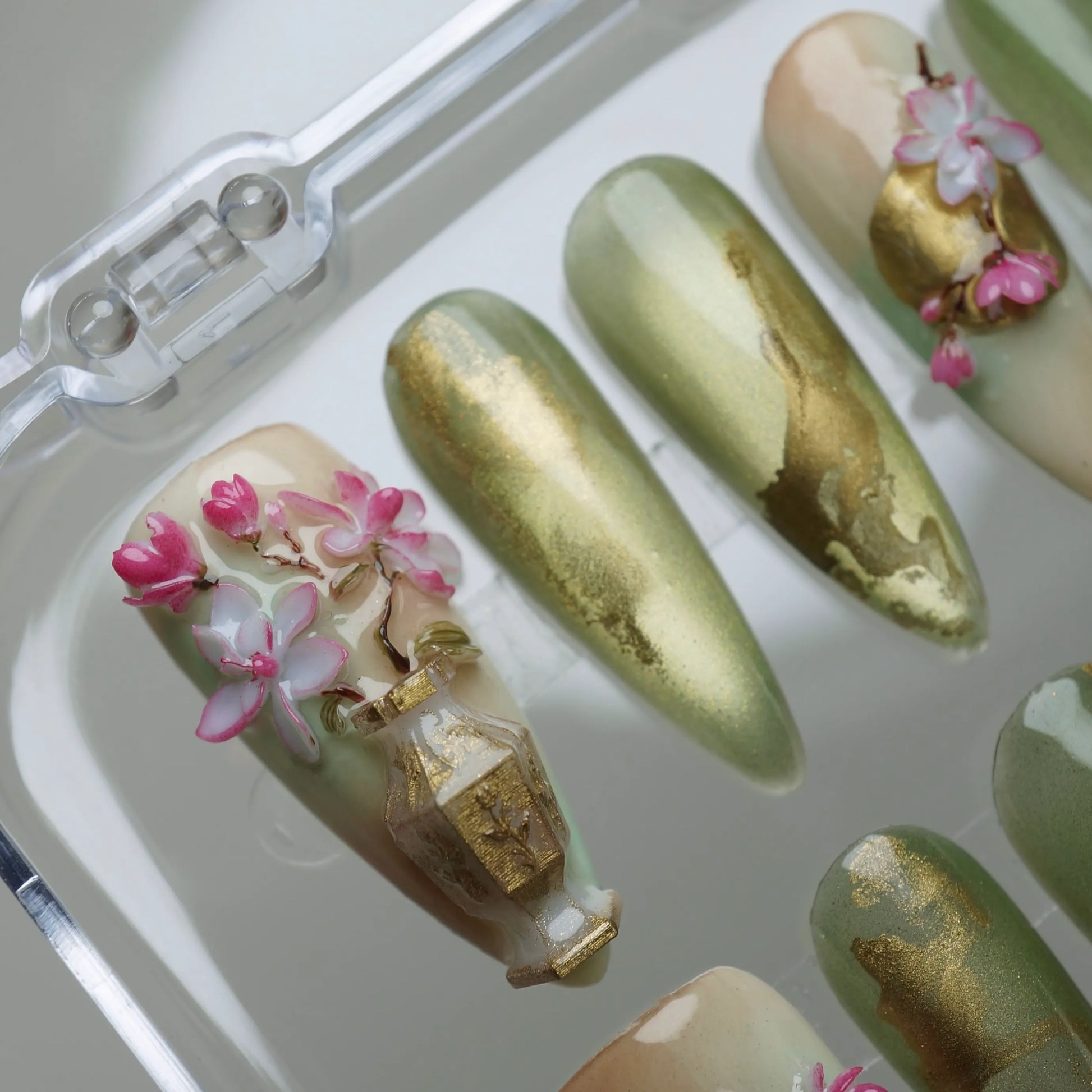 Garden Reverie press-on nail set product view with serene jade green, gold, and sculpted sakura spring nail art by Donailsart