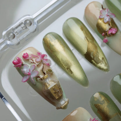 Garden Reverie press-on nail set product view with serene jade green, gold, and sculpted sakura spring nail art by Donailsart